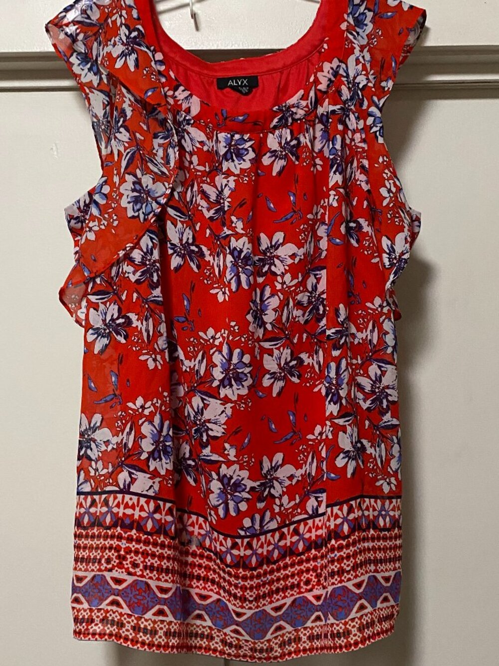 Alyx, frilly, sleeveless, red blouse w/white & purple flowers, size 1X
